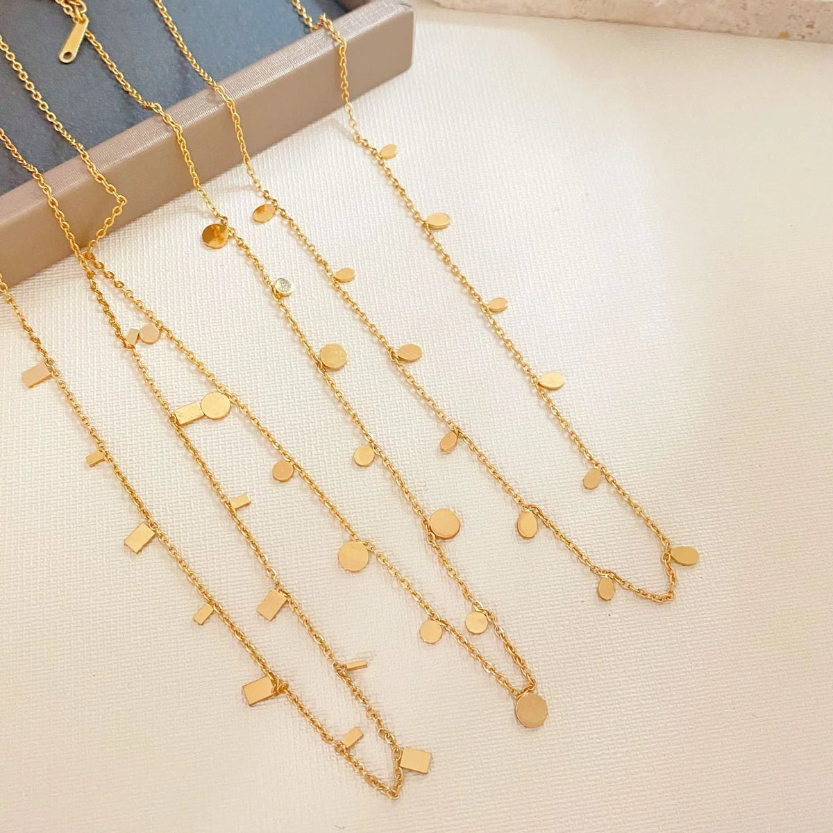 Gold electroplated titanium steel geometric pendant necklace for women in round slice, square, or water drop shape