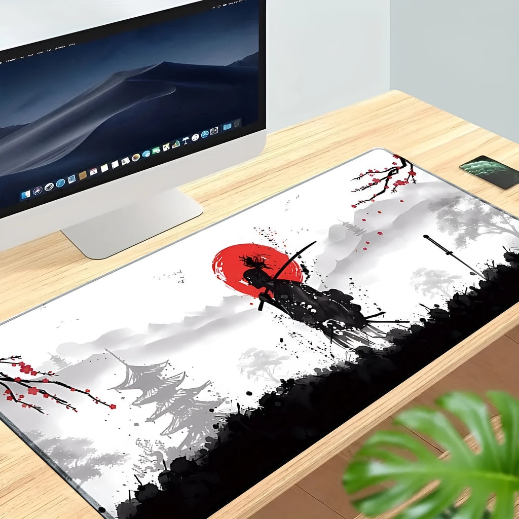 Japanese samurai design cloth gaming mouse pad on a desk with a gaming mouse.