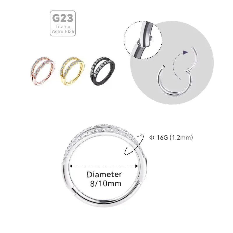 G23 titanium alloy nose ring with monoclinic diamond treatment in gold and steel colour on a grey background.