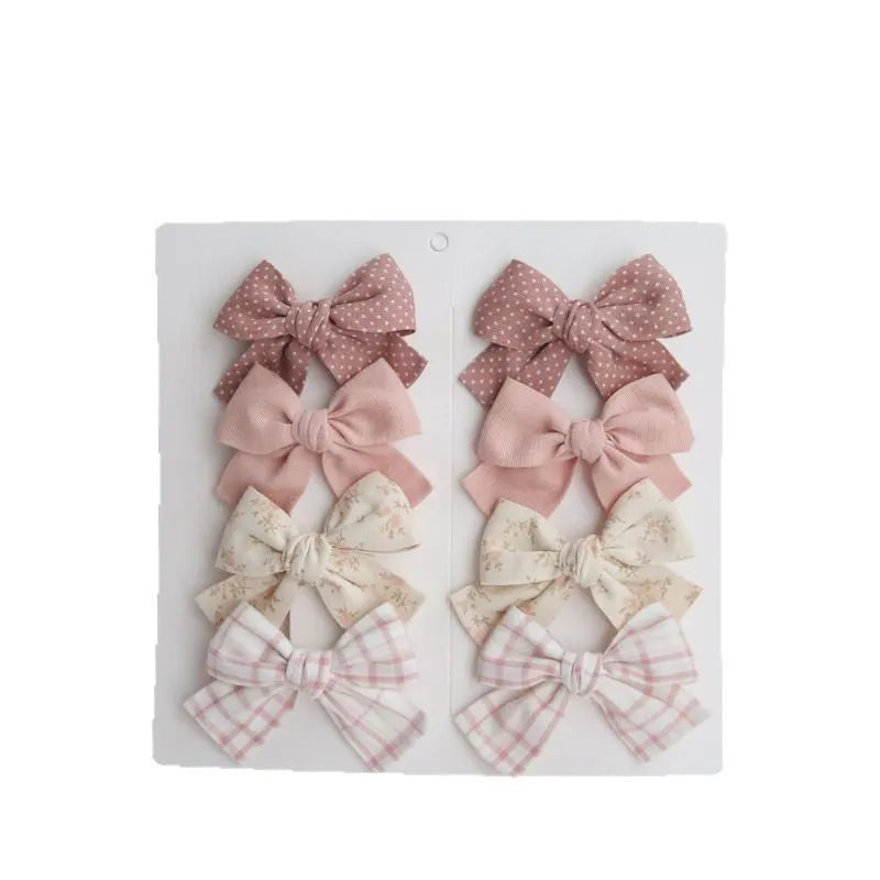 Children's cloth hairclips with dovetail bow design in multiple colour sets including beige brown grid dots