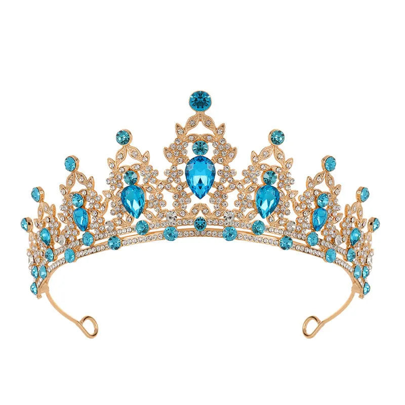A silver and rhinestone baroque bride crown headdress with intricate detailing on a white background.