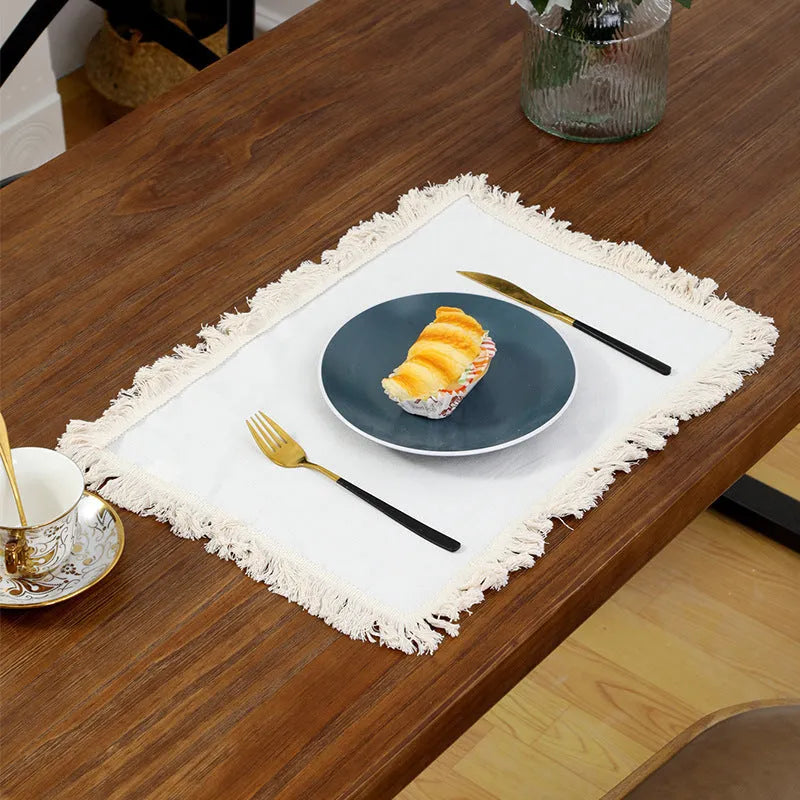 Solid colour square polyester placemat on table in beige colour