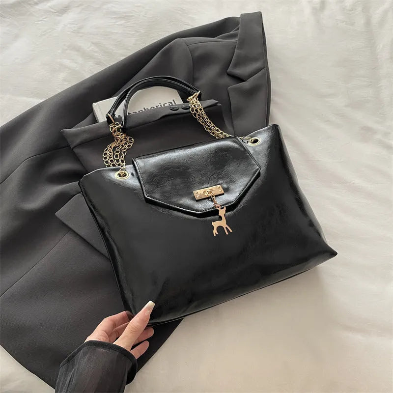 Large capacity chain shoulder bag for women in black, soft PU, horizontal square shape with chain strap
