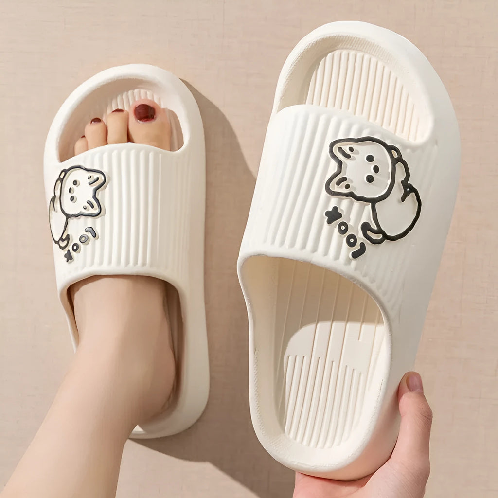 Women's green cat-themed platform slippers with non-slip EVA sole on a wooden floor.