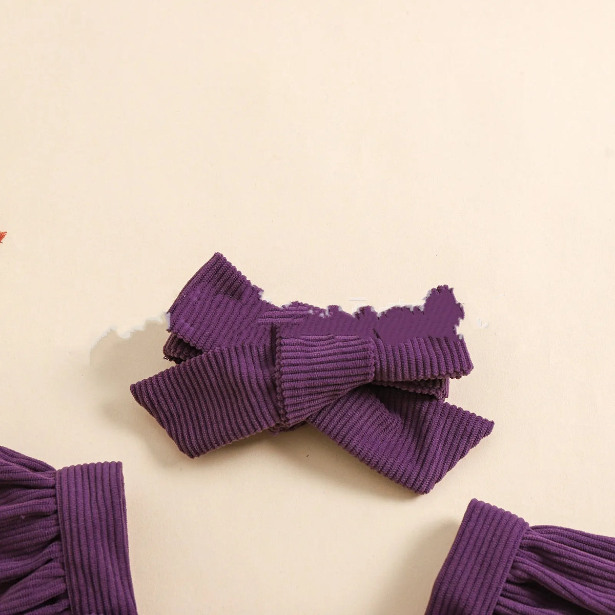 Purple Halloween toddler triangle jumpsuit with embroidered towel detail and hidden hook closure, sizes 70cm to 100cm.