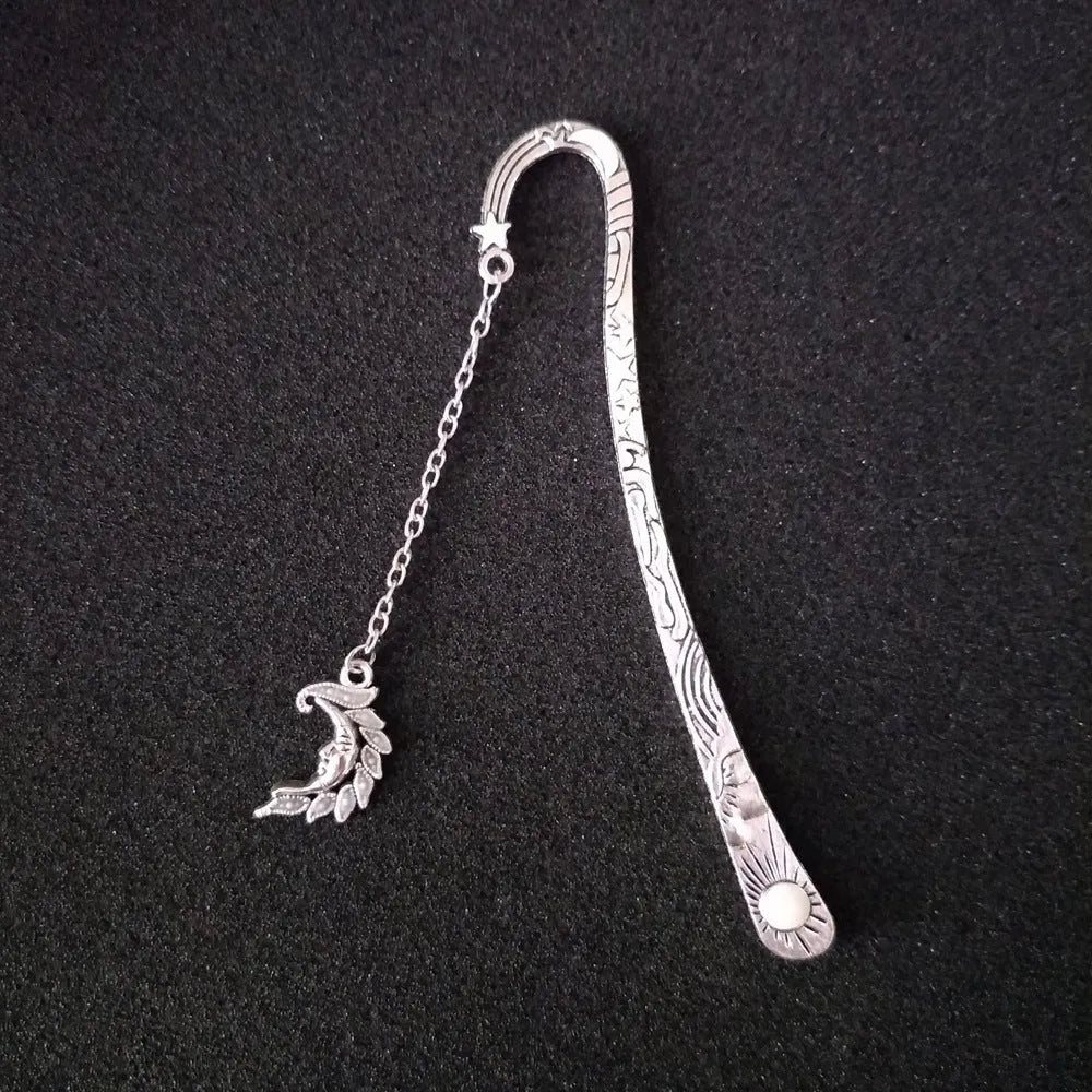 Retro five-pointed star glowing metal bookmark with celestial sun moon star design and fluorescent finish