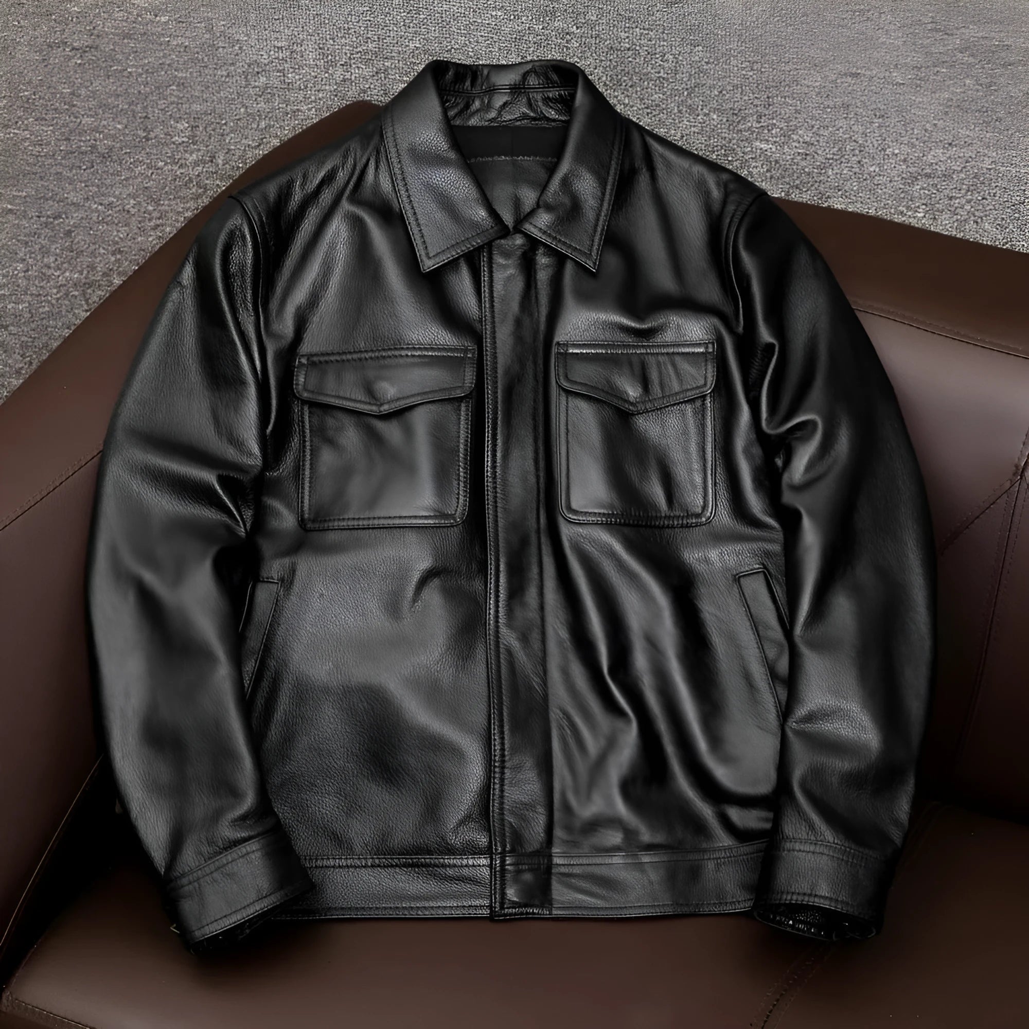 Men's brown plus size lapel leather jacket with side pockets on a hanger