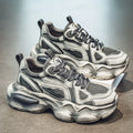 Men's black mesh platform sneaker with a rubber sole and lace-up front, shown on a white background.