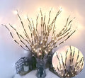 LED tree light with artificial silver branches in vase base showing multiple colour options