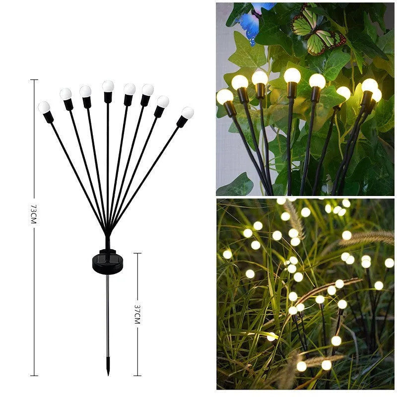 Solar-powered LED garden spike light with multiple glowing heads and a metal ground plug inserted in soil at dusk.