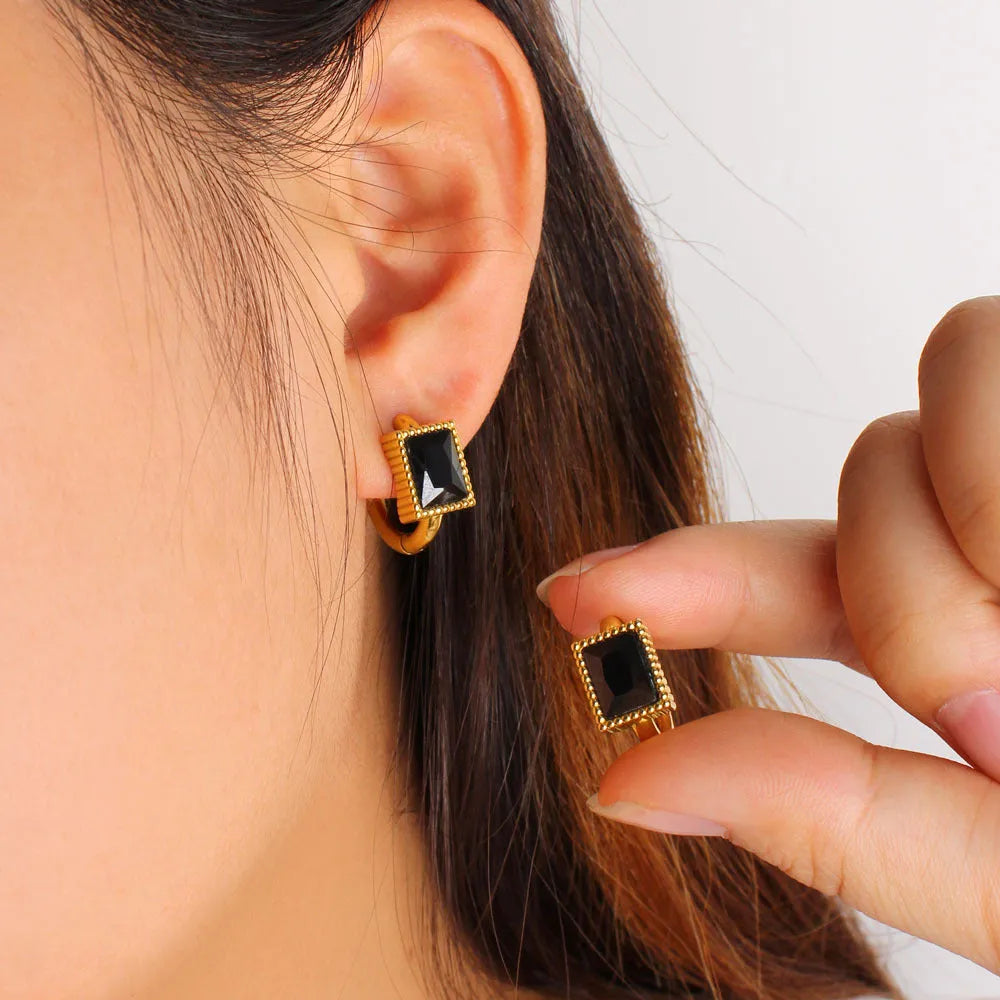 Square geometry design stainless steel earrings with a round zircon stone in black, green or white.