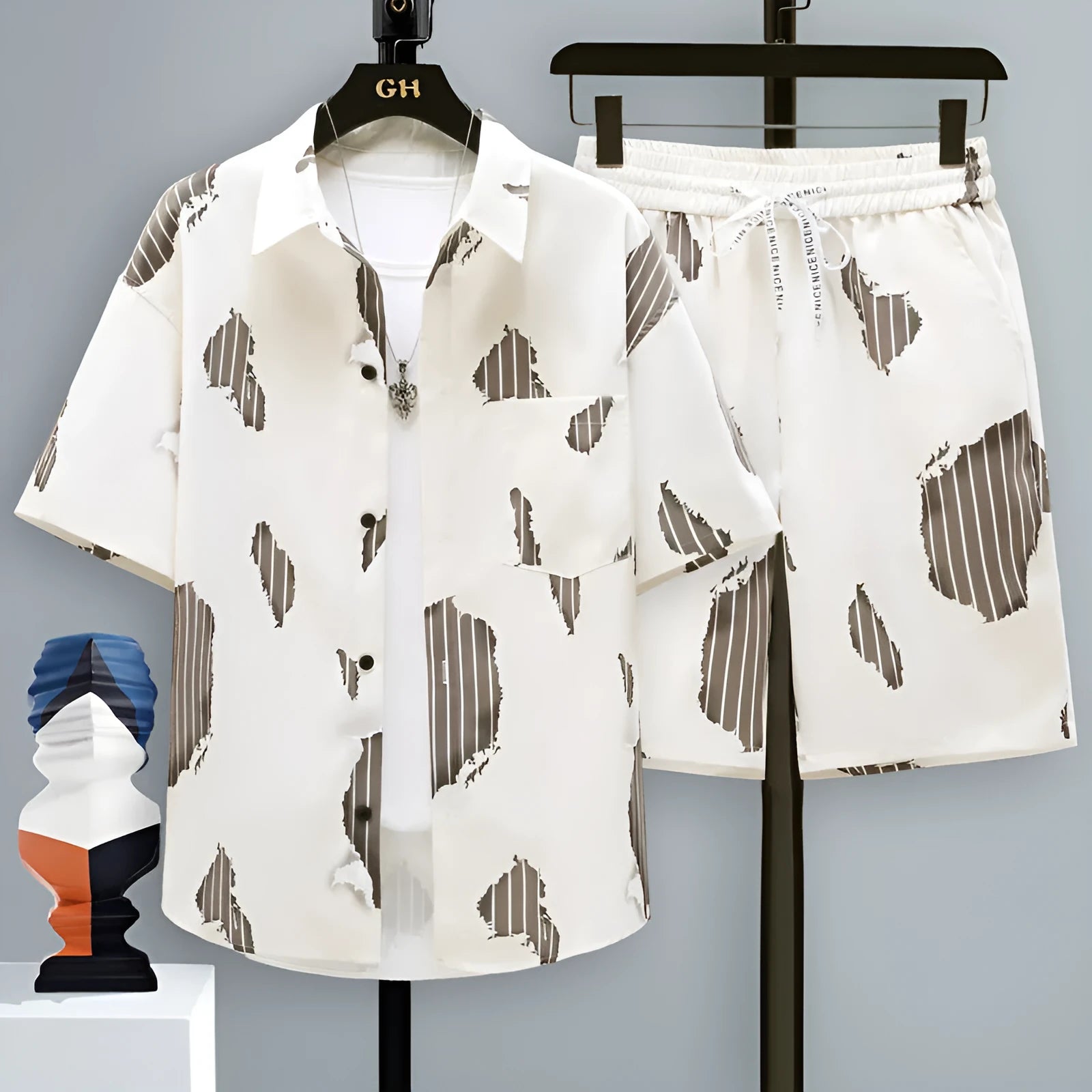 Men's casual sports shorts set in blue, showing short sleeve top and matching polyester shorts.