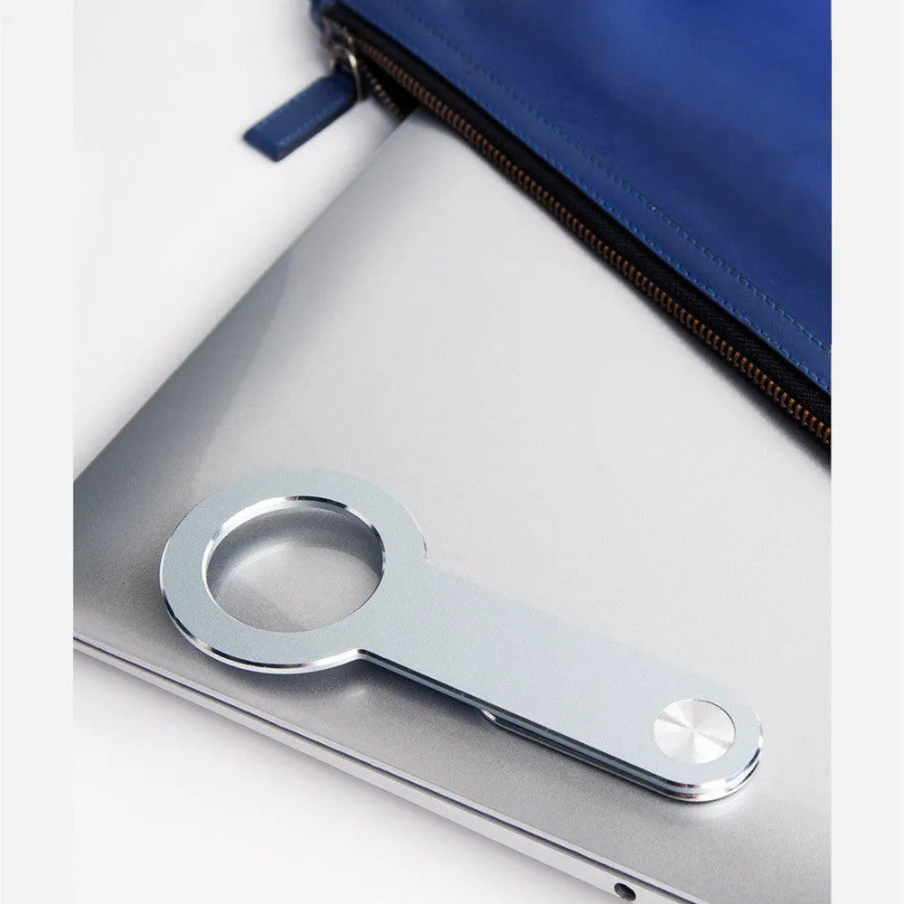 Metallic silver aluminium alloy mobile phone holder for Apple iPhone on a desk