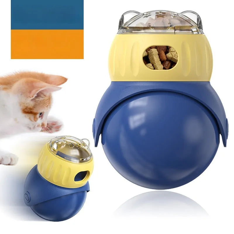 Morandi yellow and blue owl-shaped plastic puzzle feeder for cats on a wooden floor.