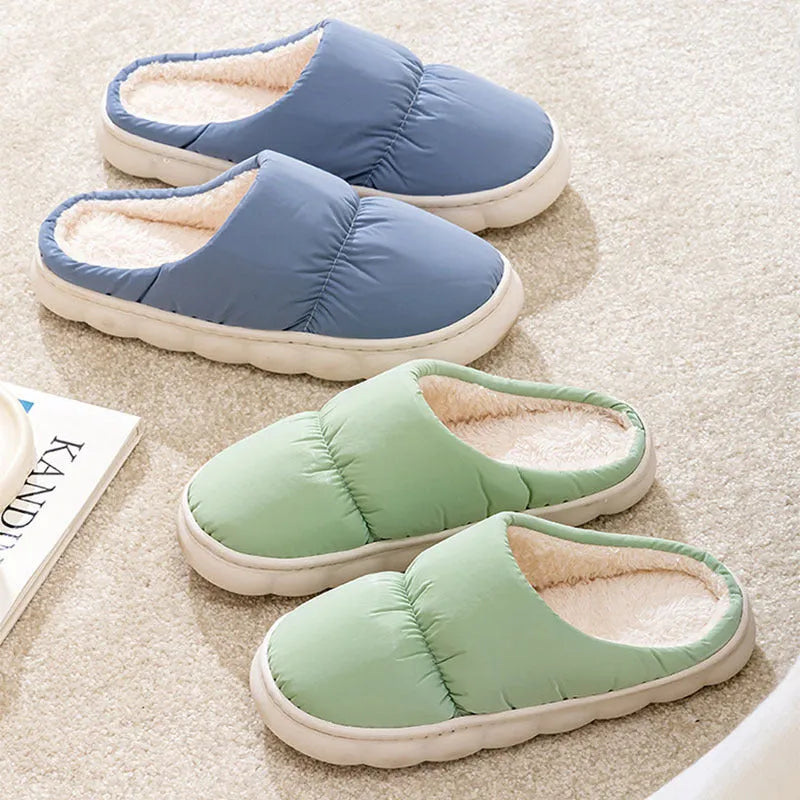 A pair of down cotton indoor slippers with a thick rubber sole and plush lining, shown in a choice of colours.