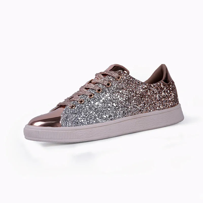 Women's black low-top casual shoes with sparkling sequinned upper and white laces.