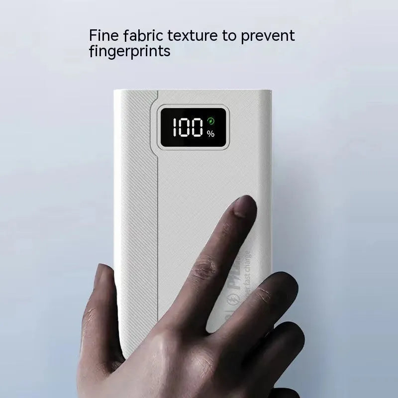 Large capacity power bank in black or white plastic casing showing front panel with charging ports