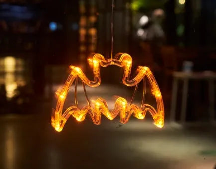 Halloween LED window lights with suction cups showing ghost, spider, and pumpkin decorations