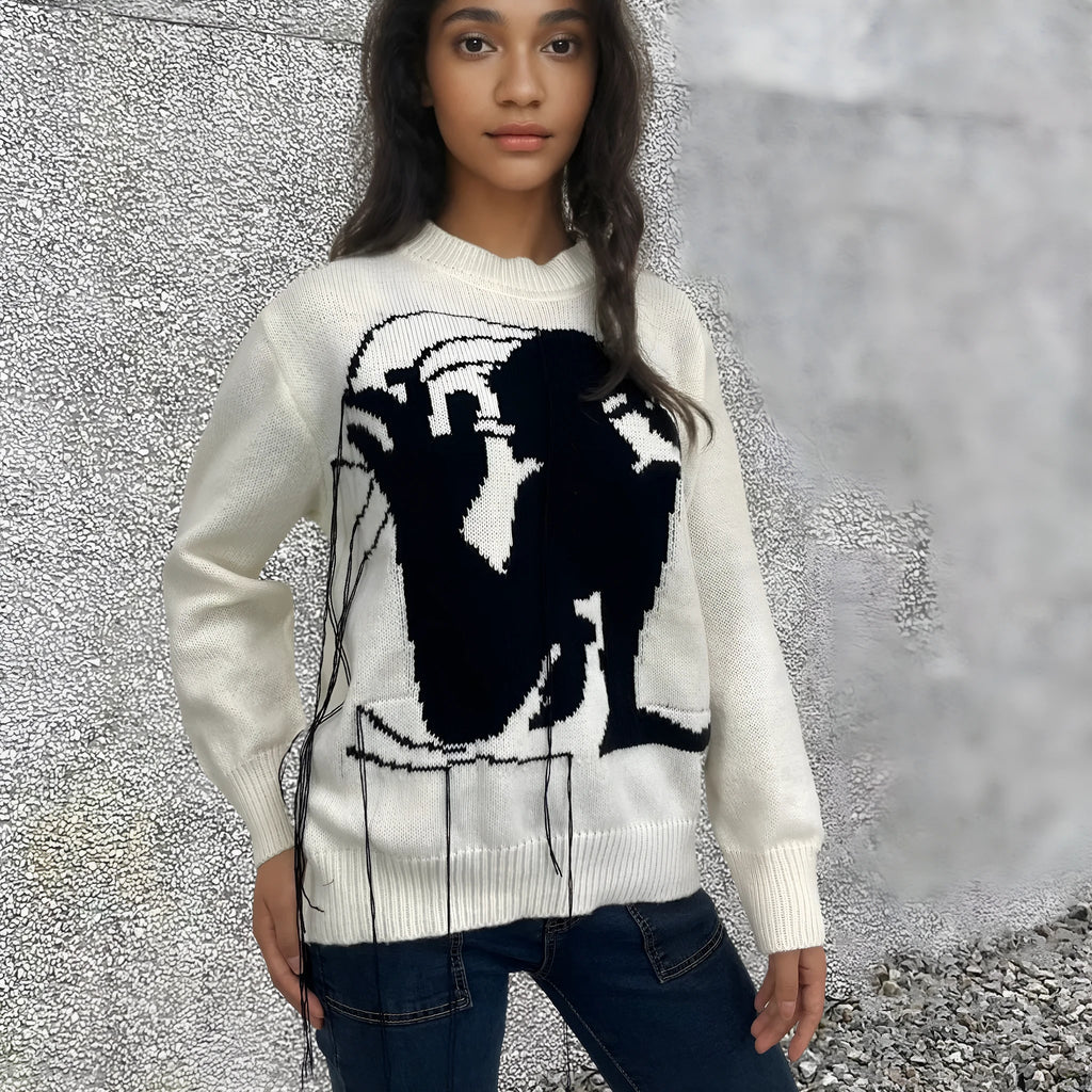 Grey women's loose alpaca wool sweater with tassel detailing and abstract pattern