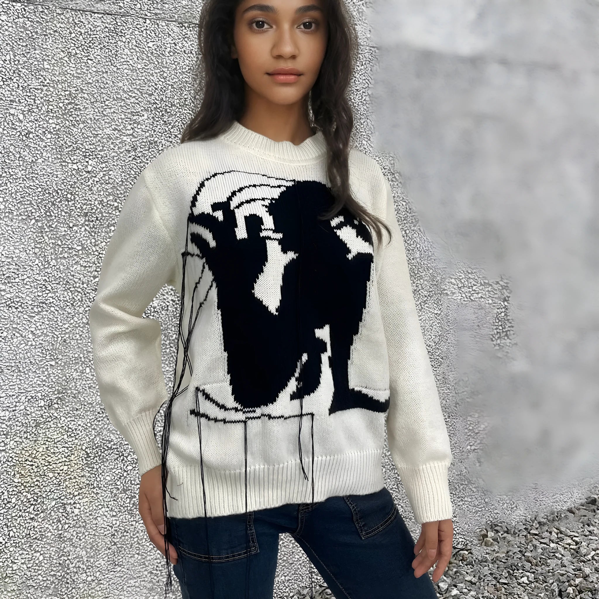 Grey women's loose alpaca wool sweater with tassel detailing and abstract pattern