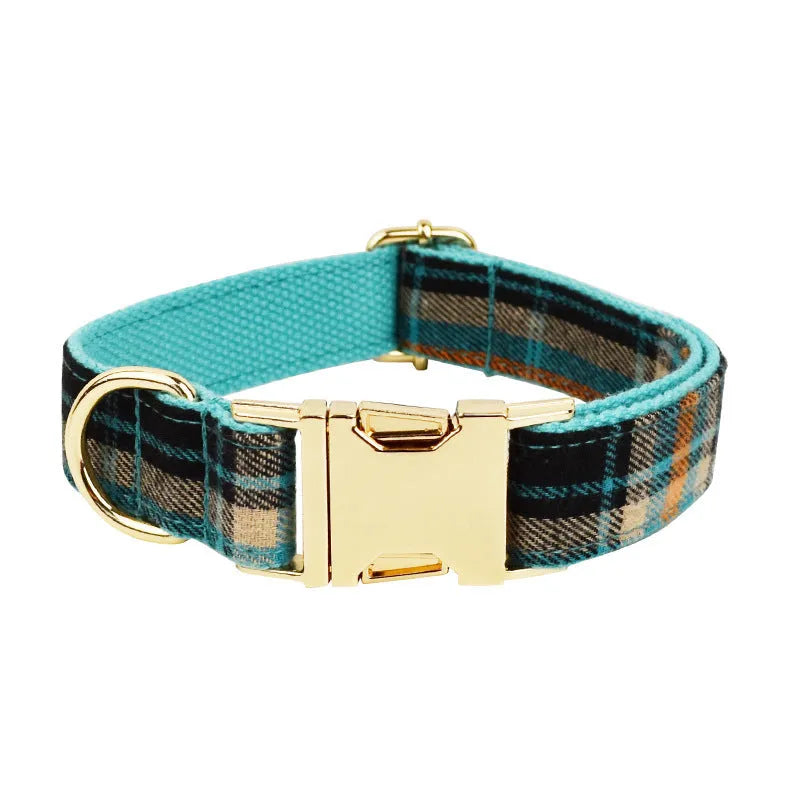 Green cloth dog collar and leash set with matching vest and bow accessory in four-piece pet package