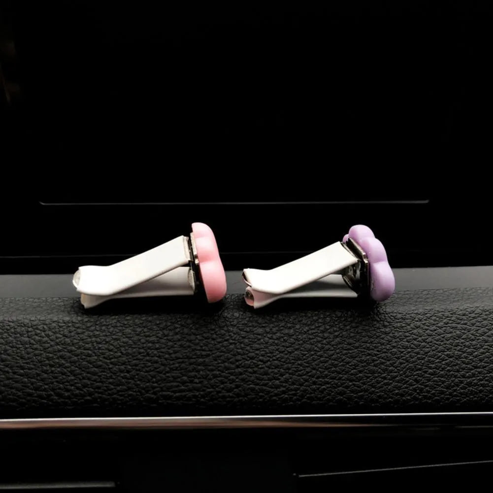 Colourful resin cartoon cloud car air freshener clip on a car vent.