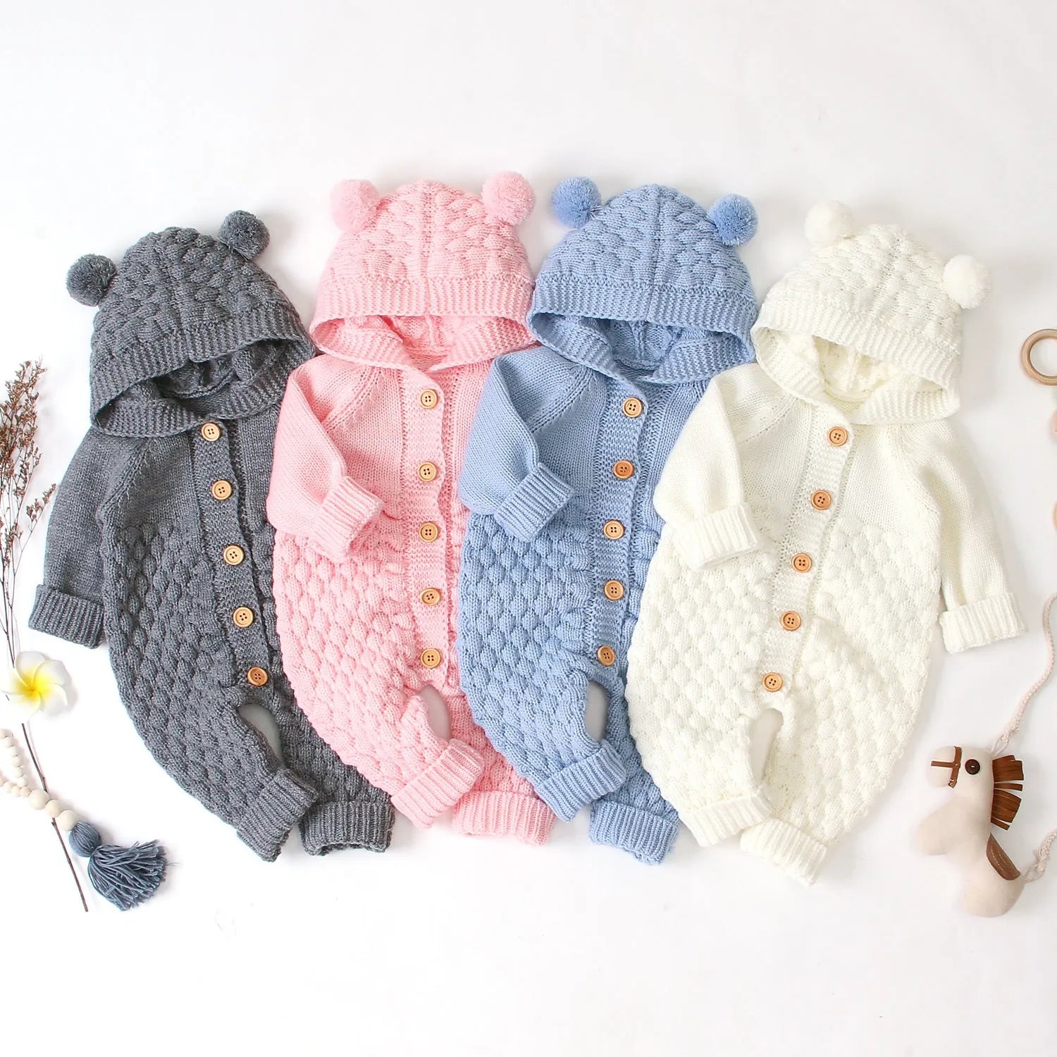 Baby knitted jumpsuit in blue, full-length with button front and hand flaps