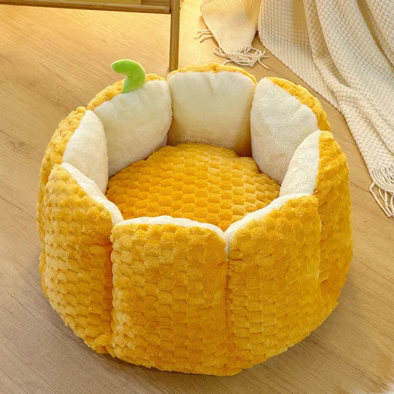 Orange pumpkin-shaped enclosed pet bed for cats or small dogs with cotton filling.