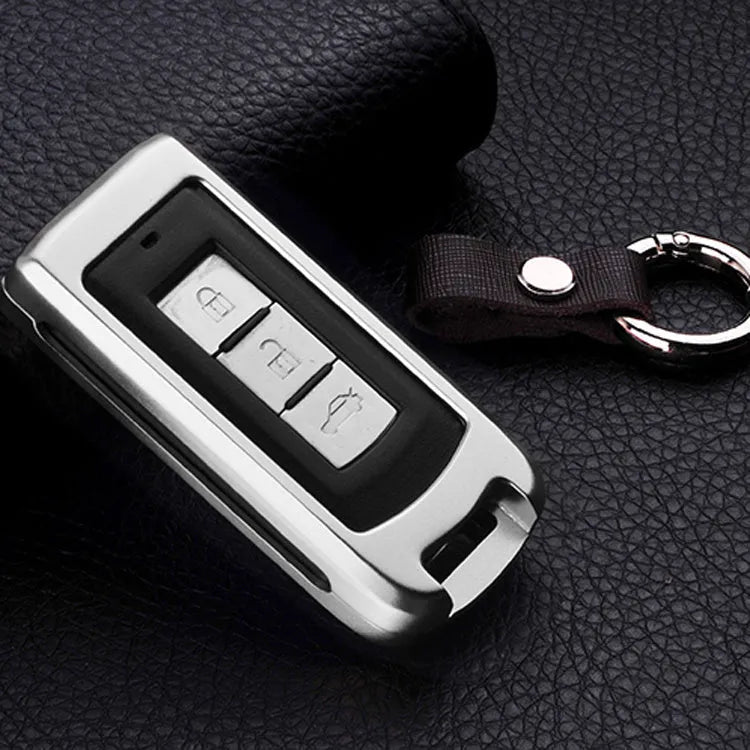 Aluminium alloy key shell sleeve buckle cover for car key protection in silver with cowhide leather accent