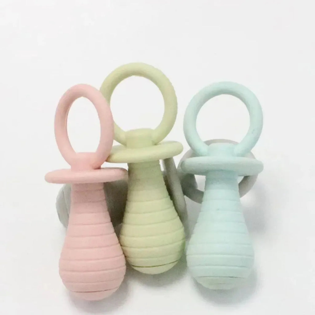 Set of four TPR rubber pet pacifier chew toys with squeakers in blue, gray, green and pink colours