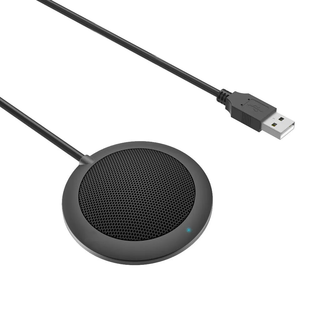 Black USB desktop microphone with metal mesh cover and zinc alloy shell on a computer desk