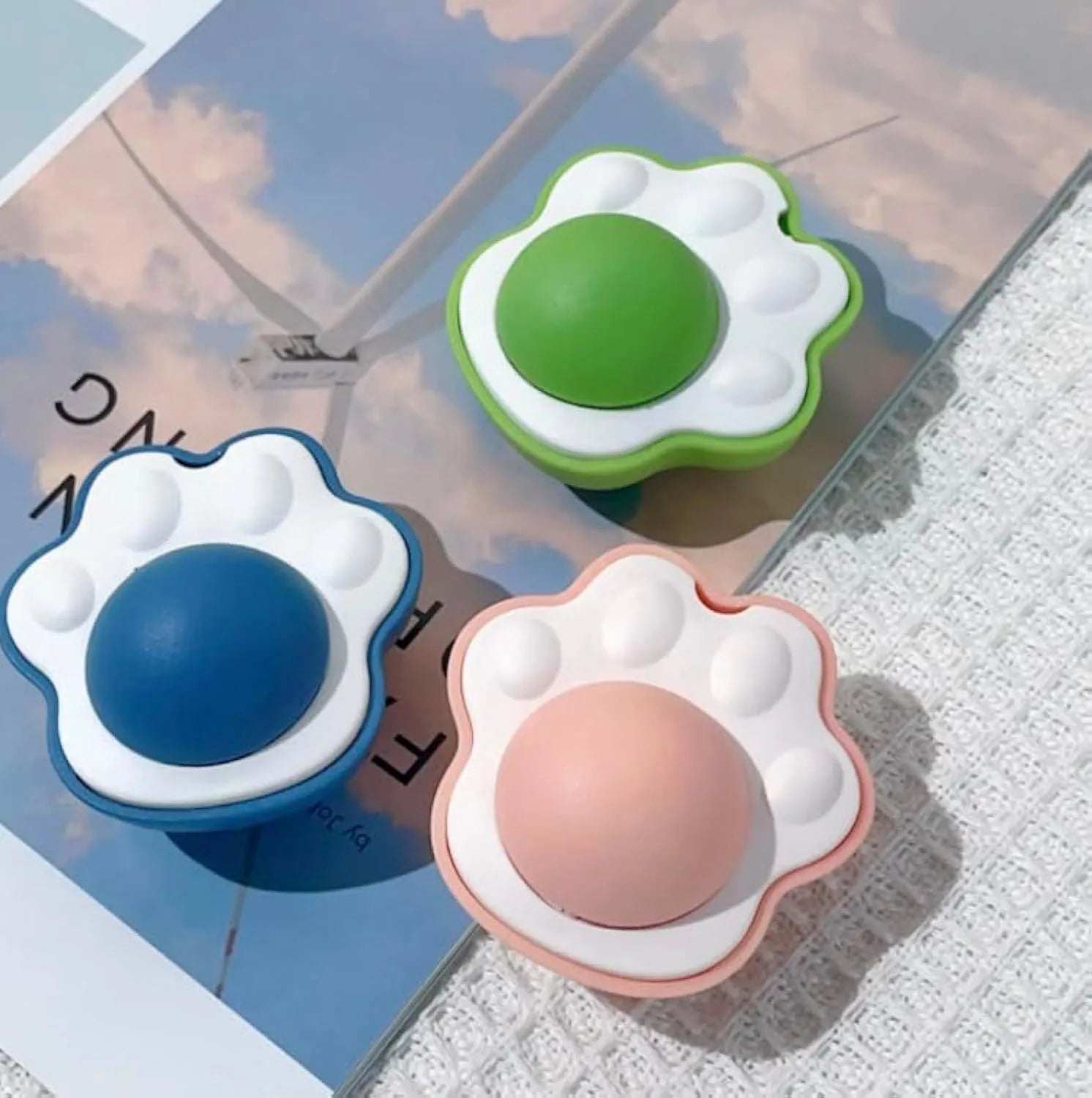 Blue, green, and pink edible vine catnip balls for cats, shown as dental chew and play toys.