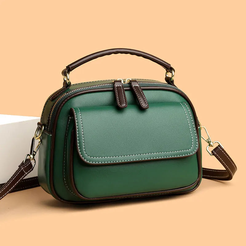Women's cross-body portable shoulder bag in horizontal square shape with black, green or orange colour options