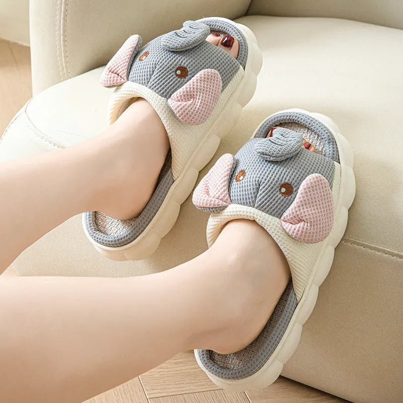 Elephant grey animal print open-toe linen slippers for couples on a PVC sole.