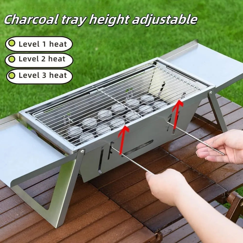 Small foldable portable charcoal grill for outdoor use.