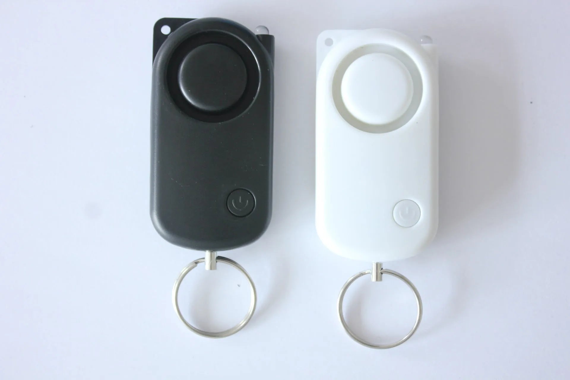 Runner Personal Alarm with LED flashing light and adjustable black wristband on white background