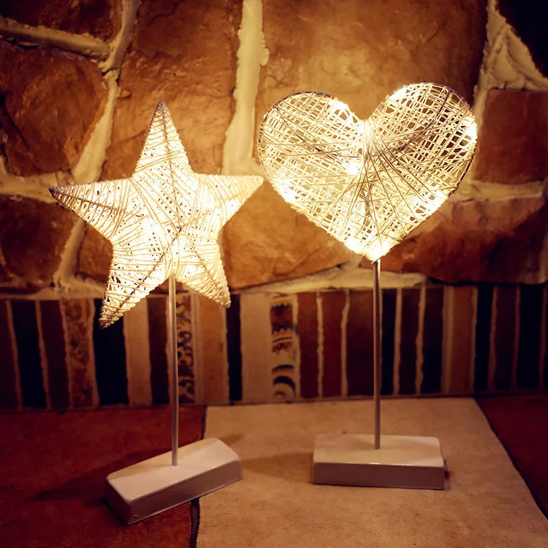 Rattan and copper wire LED table lamp in star, love heart, or moon shape for bedroom decoration.