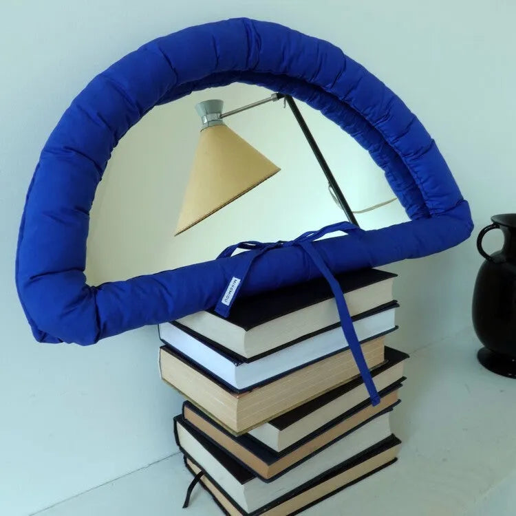 Soft cotton-filled hanging mirror in modern solid colour design