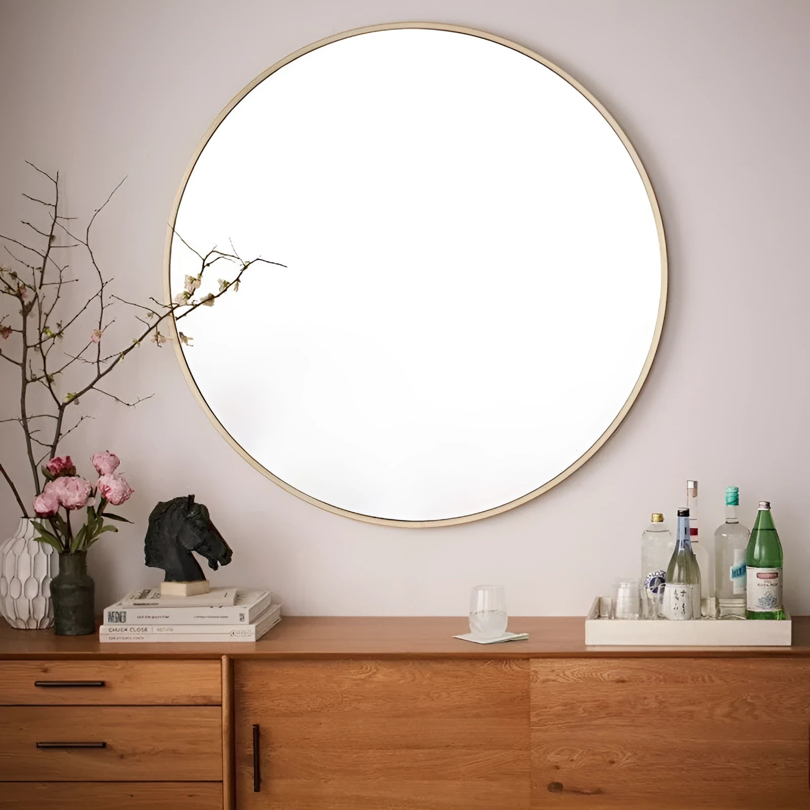 Round iron-framed bathroom wall mirror in black, gold, or white, shown in 30cm and 60cm sizes.