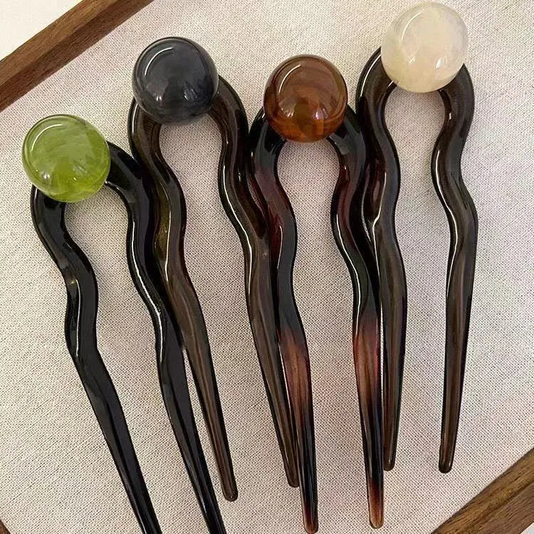 U-shaped acrylic hair barrettes with ball retro design in beige, caramel, dark gray and green colours