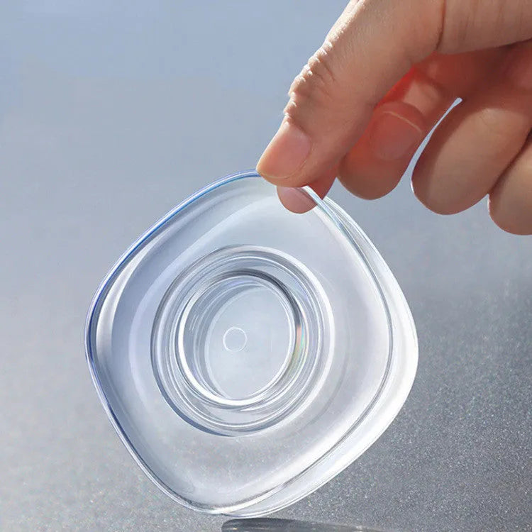 Transparent circular and square silicone nano gel adhesive pads on a car dashboard holding a mobile phone.