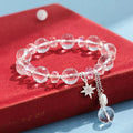 Women's white crystal bracelet with lucky cat charm and diamond-shaped stones on adjustable electroplated band