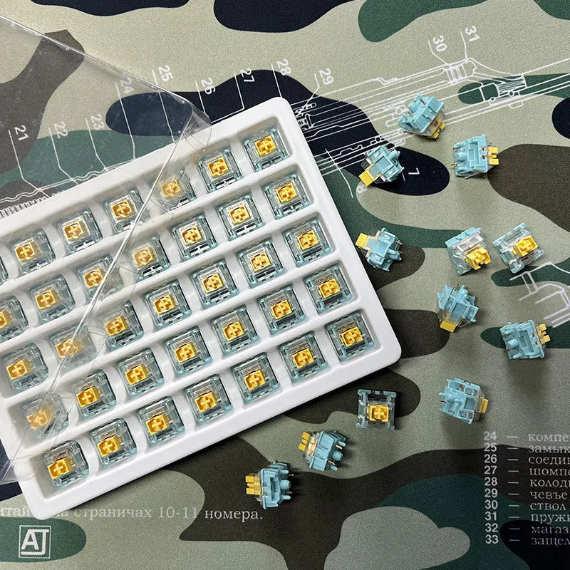 Pack of 36 Tiger Mo Sea Salt Lemon PRO Mute coloured mechanical keyboard switches.