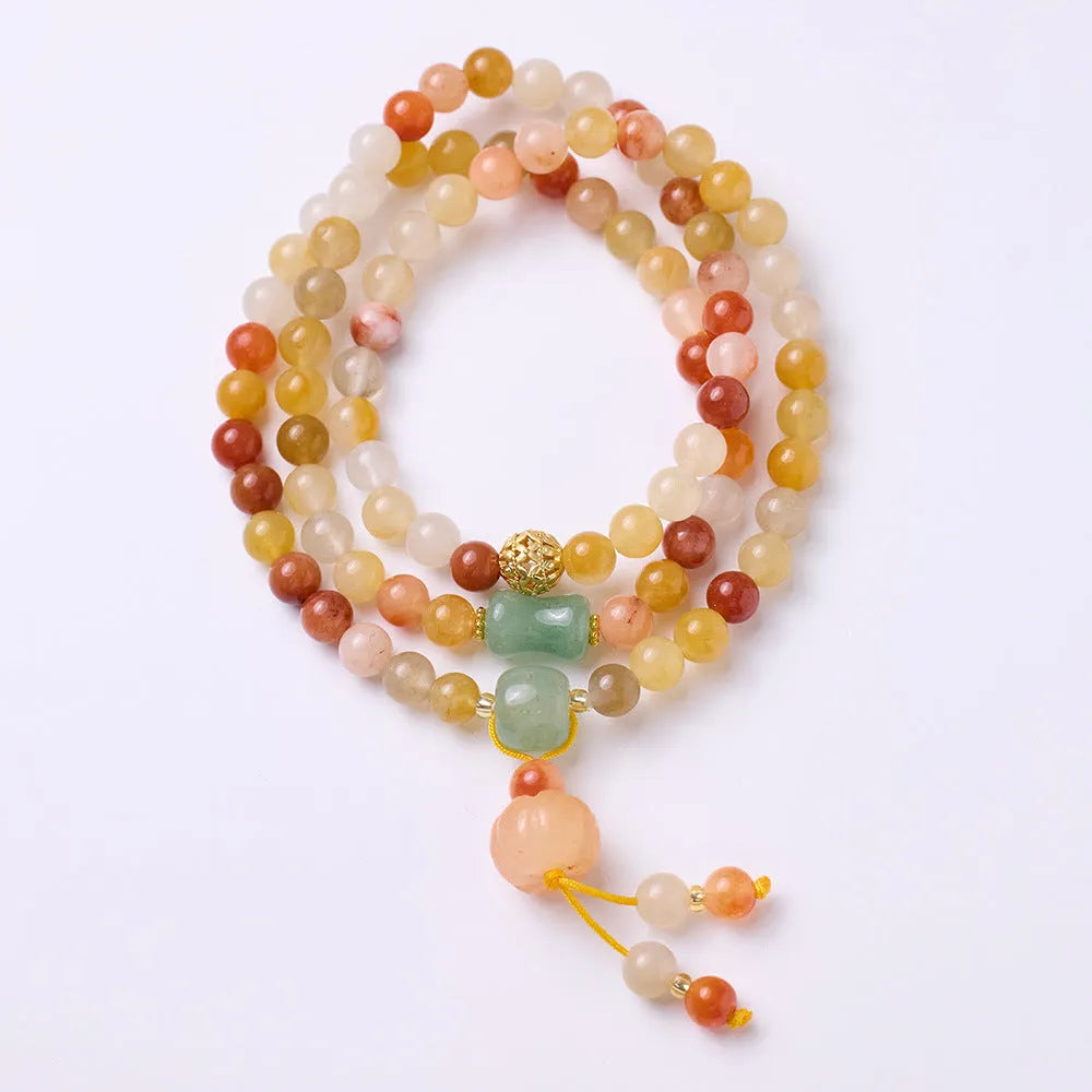 Women's handcrafted Jinsi Jade bracelet with three pumpkin circles and tassel decoration