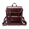 Black cowhide leather laptop backpack for women with a structured, hard-sided design.