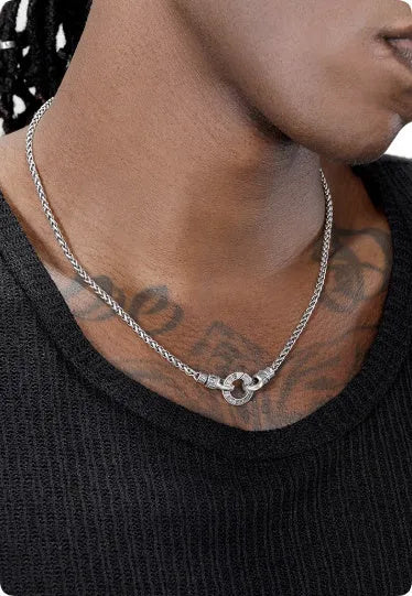 A sterling silver S925 clavicle necklace with a small pendant on a thin chain.