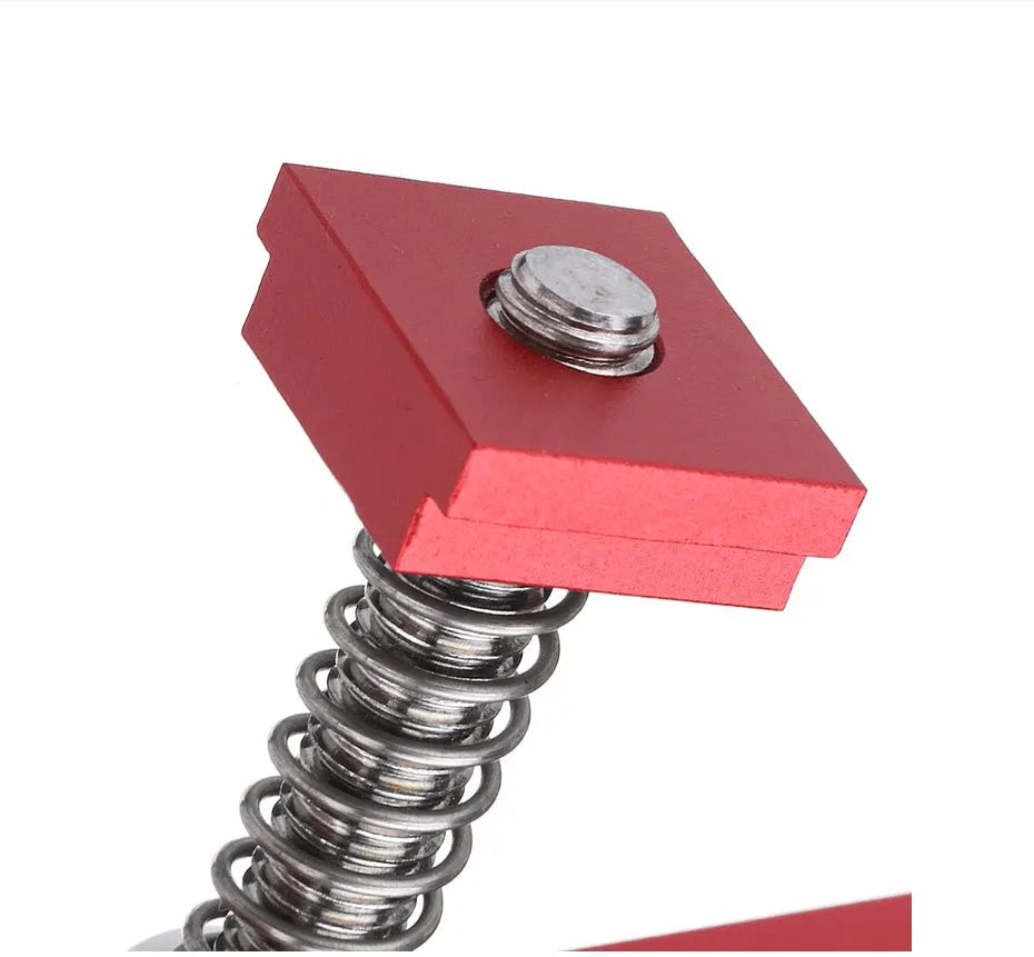 Red aluminium alloy woodworking table block slide holder with flat mouth design on workbench