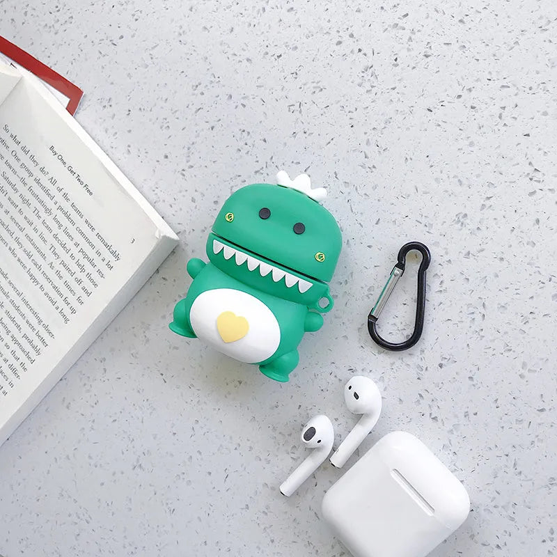 Green silicone AirPods 1/2 generation case with a cartoon animal design on a table.