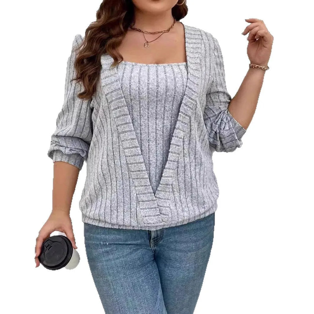 Woman wearing a solid colour purple rib knit V-neck long sleeve false two-piece suit with a loose fit.