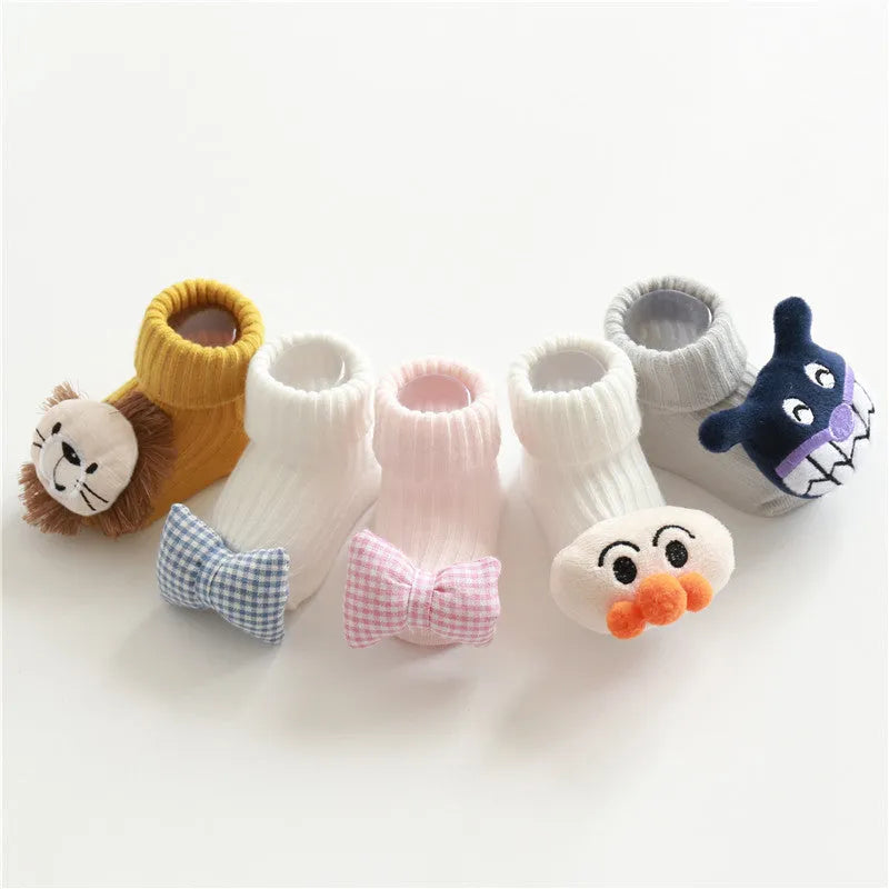 Pair of cotton baby socks in a pink colour with a star print design, shown flat.